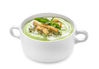 Bowl with delicious zucchini soup on white background