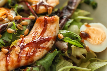 Tasty chicken salad on plate, closeup