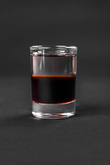 Shot of cocktail isolated black