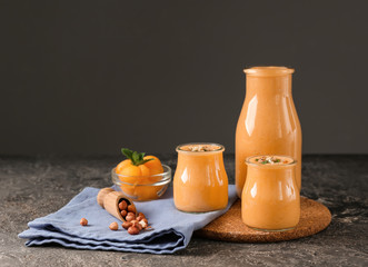 Composition with tasty melon smoothie on table