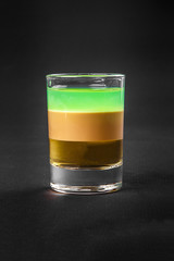 Shot of cocktail isolated black