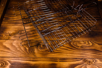 Fototapeta na wymiar Empty barbecue grill on a wooden table