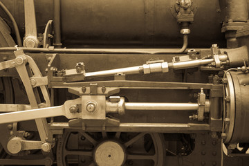 Old mechanism toned photo.  Retro style machinery, gear, metal cogwheels, nuts and bolts.