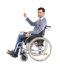 Male teacher in wheelchair with books on white background