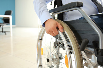 Businessman in wheelchair indoors