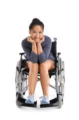 Fototapeta na wymiar Asian woman in wheelchair on white background