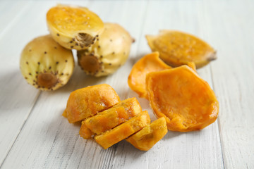 Ripe cactus pears on wooden table