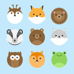 Cute vector icon set of forest animals. Round animal illustrations; deer, fox, hedgehog, badger, bear, wolf, owl, squirrel and frog. Isolated on baby blue background.