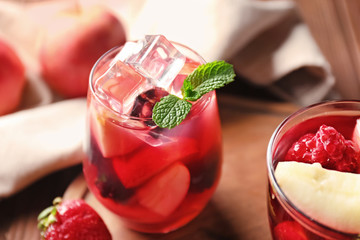 Fresh summer cocktail in glass on wooden table