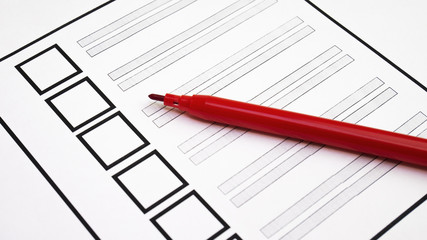 Voting paper ballot with red pens