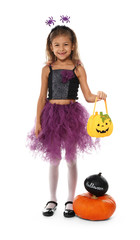Cute little girl dressed for Halloween on white background