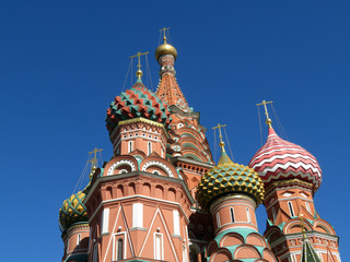 Fototapeta na wymiar View of the St. Basil's Cathedral against the clear blue sky. Russian architecture landmark, located on Red square in Moscow