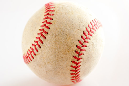 Sports Equipment old Baseball on white background