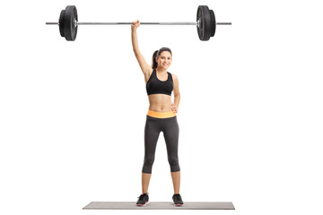 Young woman lifting a barbell with one hand