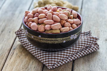 beans in cup on wooden table.
