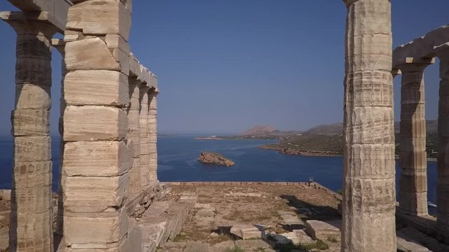 Flight through (! ) Greek temple of Poseidon in morning light. Aerial drone view