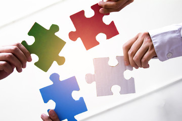 Group  asian business  of hands holding Primary colors jigsaw, Concept teamwork  success.