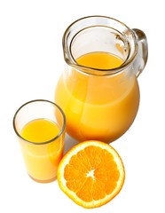 Pitcher and glass of freshly squeezed orange juice