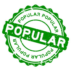 Grunge green popular word round rubber seal stamp on white background