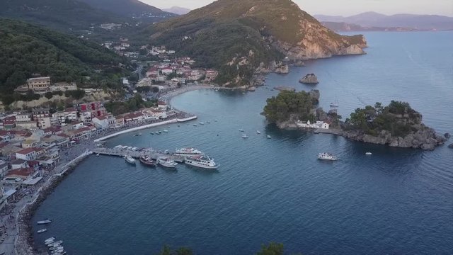 Evening/sunset in Greece. Typical traditional greek village by the sea. drone