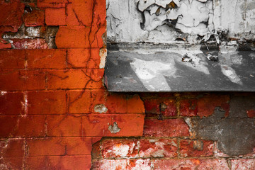 Naklejka premium Broken brick wall with an old window sill