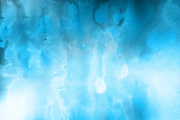 Blue winter watercolor ombre leaks and splashes texture on white watercolor paper background. Painted ice, frost and water.