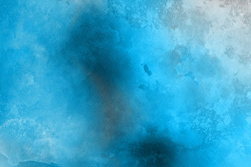 Blue winter watercolor ombre leaks and splashes texture on white watercolor paper background. Painted ice, frost and water.