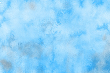 Blue winter watercolor ombre leaks and splashes texture on white watercolor paper background. Painted ice, frost and water.