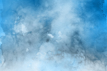 Blue winter watercolor ombre leaks and splashes texture on white watercolor paper background. Painted ice, frost and water.
