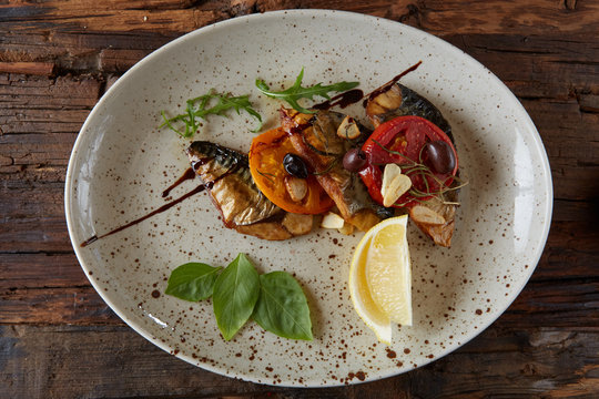 The fried mackerel with vegetables. Shallow dof.