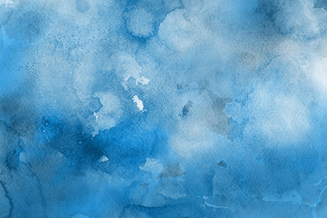 Blue winter watercolor ombre leaks and splashes texture on white watercolor paper background. Painted ice, frost and water.