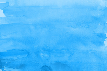 Blue winter watercolor ombre leaks and splashes texture on white watercolor paper background. Painted ice, frost and water.