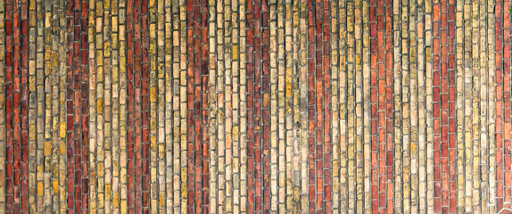 Texture of a wall from a red tile. Building background