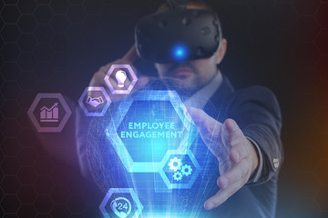 The concept of business, technology, the Internet and the network. A young entrepreneur working on a virtual screen of the future and sees the inscription: Employee engagement