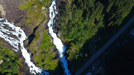 Naklejka na ściany i meble Aerial view of Waterfall Latefossen at sunset lights in summer in Norway