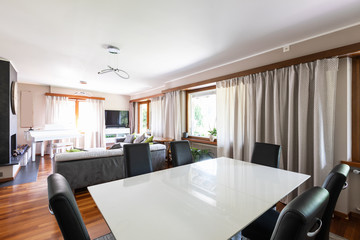 Living room with dining room and large windows