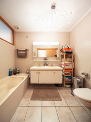 Large bathroom with tiles and window