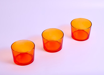 Three orange glasses