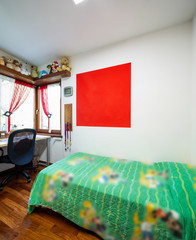 Teen boys bedroom with many plush and parquet