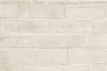 Cream and white brick wall texture background. Brickwork or stonework flooring interior rock old pattern clean concrete grid uneven bricks design stack.