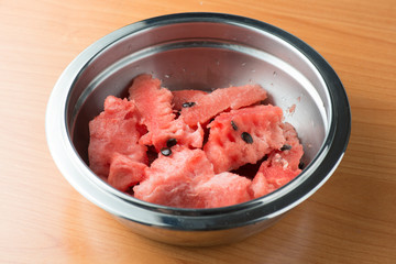 ripe watermelon in the shiny metal bowl flesh closeup macro texture background