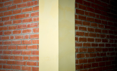 Corner of dark brick wall