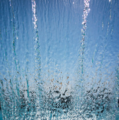 Naklejka na ściany i meble Waterfall jet at the swimming pool