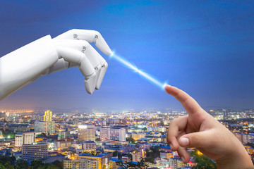 Robotic artificial intelligence future transition child human hand finger hit robot hand press