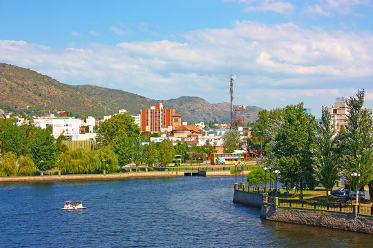 VILLA CARLOS PAZ, CORDOBA, ARGENTINA - APRIL 11, 2009: Panoramic view of the landscape of Carlos Paz Town in a sunny day. The San Roque lake in foreground and the hills at the background.