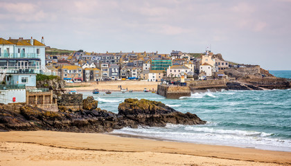 Harbour at St Ives with waves crashing against the harbour wall taken in St Ives, Cornwall, UK on...