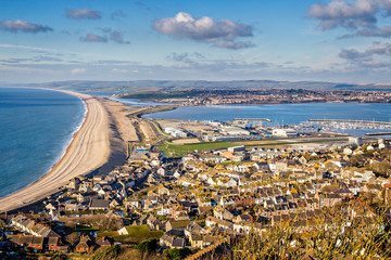 Seascape of Chesil beach and Portland harbour looking towards Weymouth, Dorset - obrazy, fototapety, plakaty