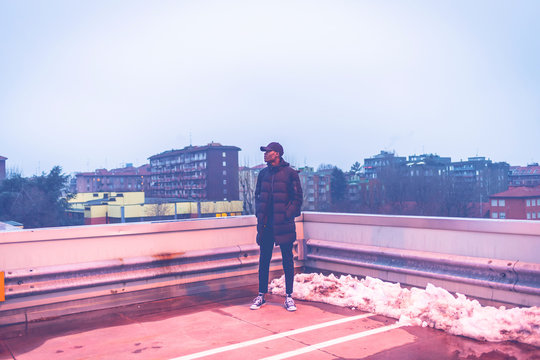 Young African Man Outdoors Posing Parking Lot Looking Away - Rebel, Rude Boy, Swag Concept