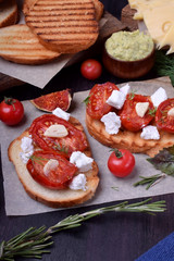 Bruschetta with sun dried cherry tomatoes and feta cheese. Italian cuisine appetizer