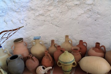 Fototapeta na wymiar ceramic amphoras jugs and jars in cave